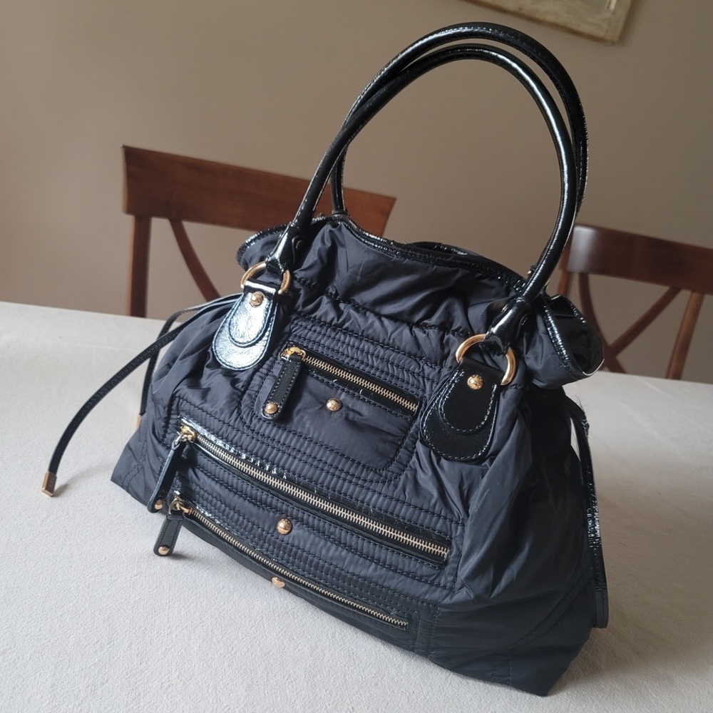 Authentic Tod’s nylon cross body bag, color back, preowned.